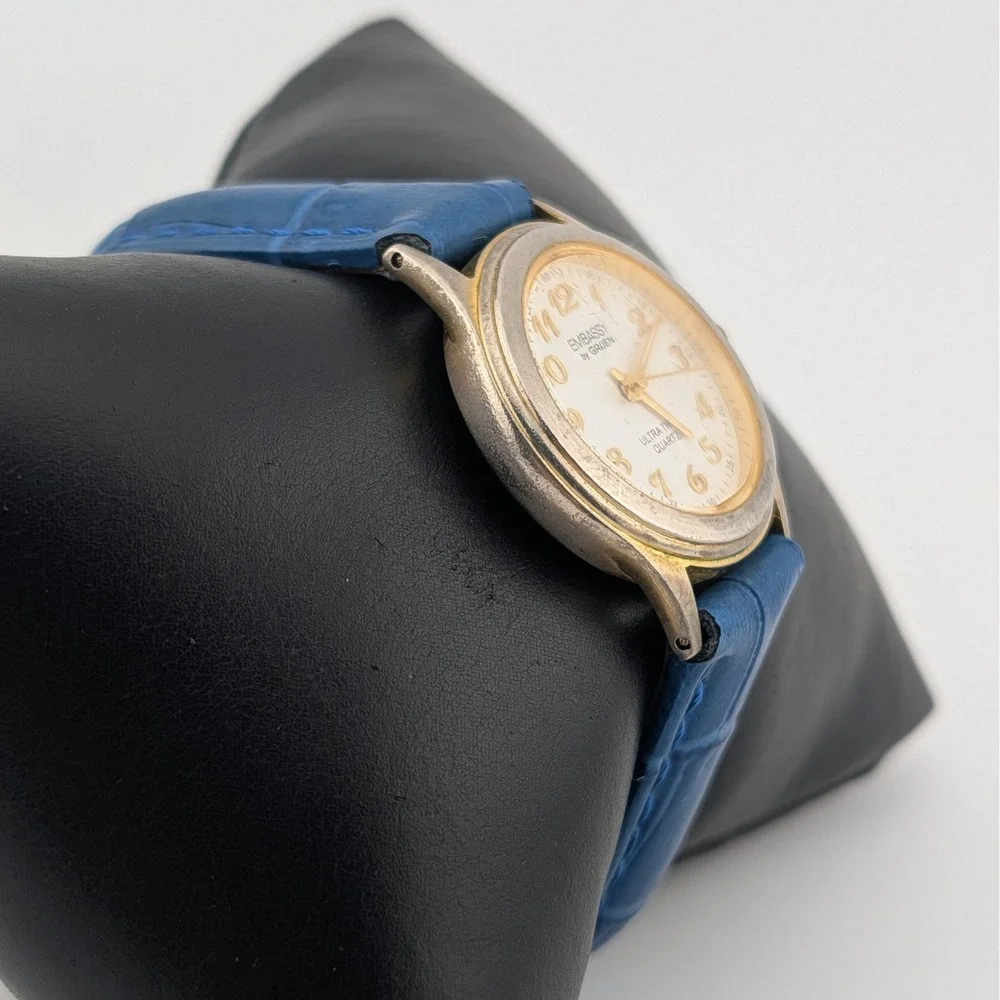 Embassy‎ by Gruen Ultra Thin Quartz Watch Gold Tone White Dial Blue Strap W1780